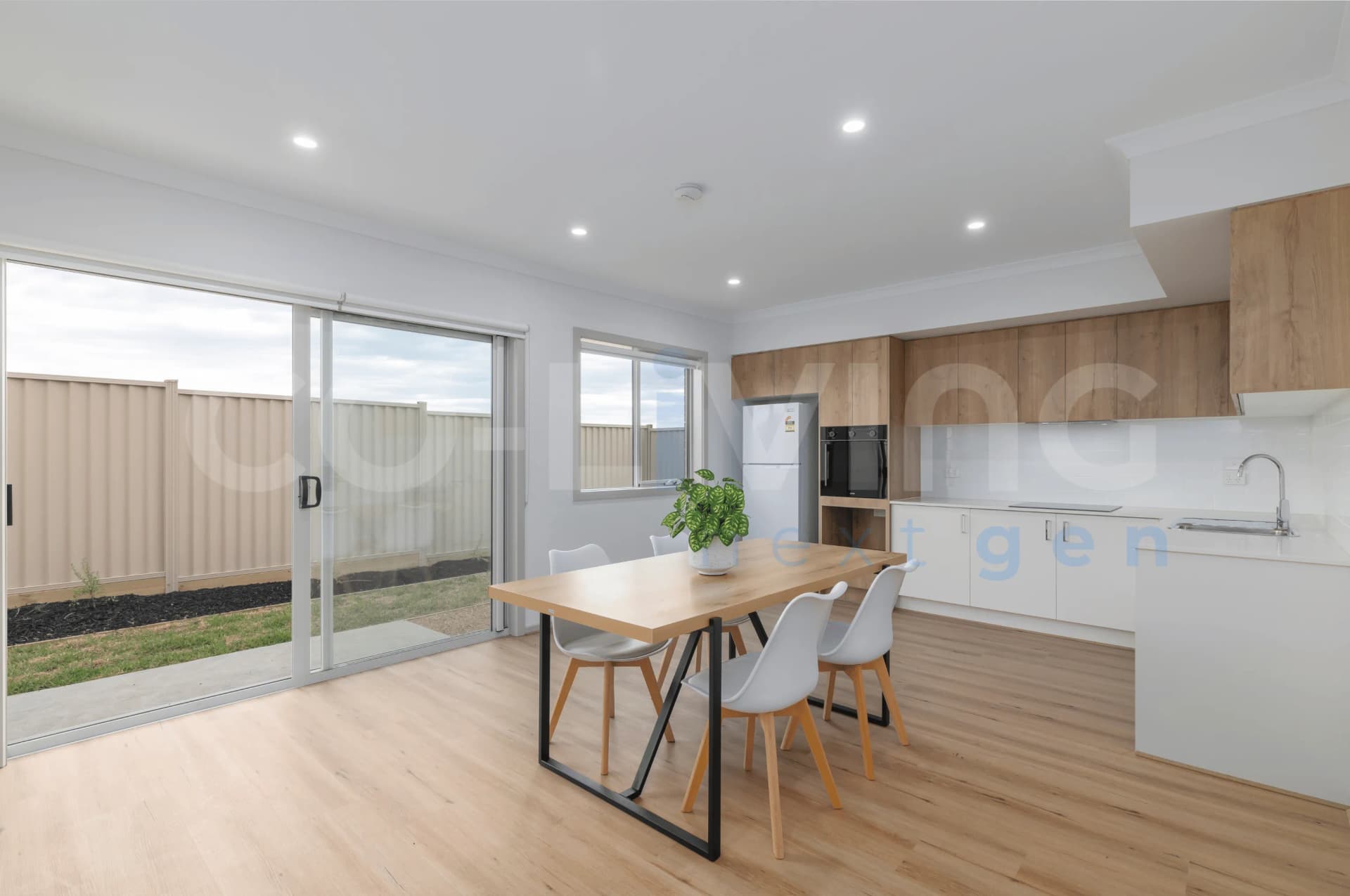 Spacious shared kitchen with timber dining table