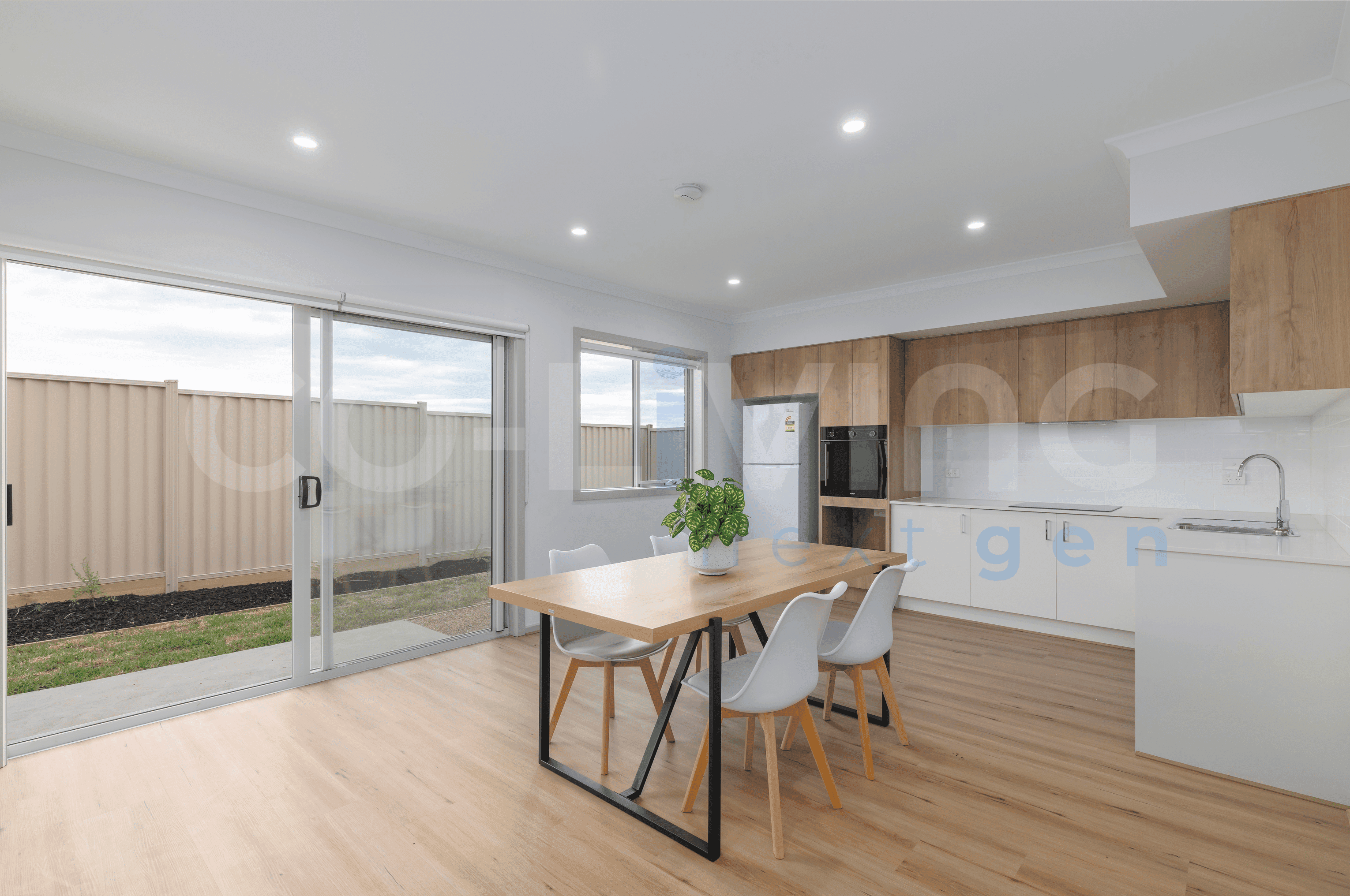 Spacious shared kitchen with timber dining table