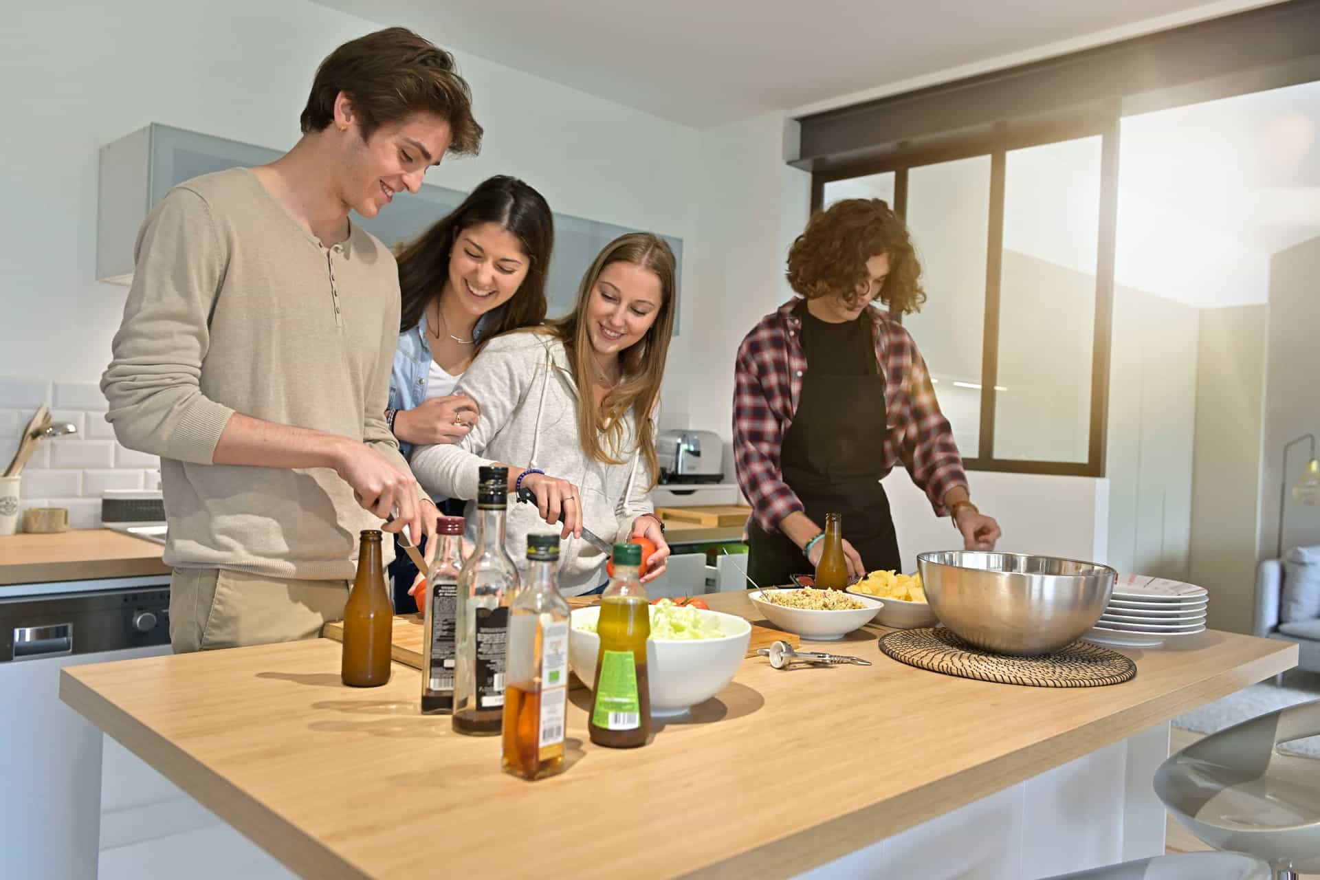 Co-living tenants in a shared kitchen