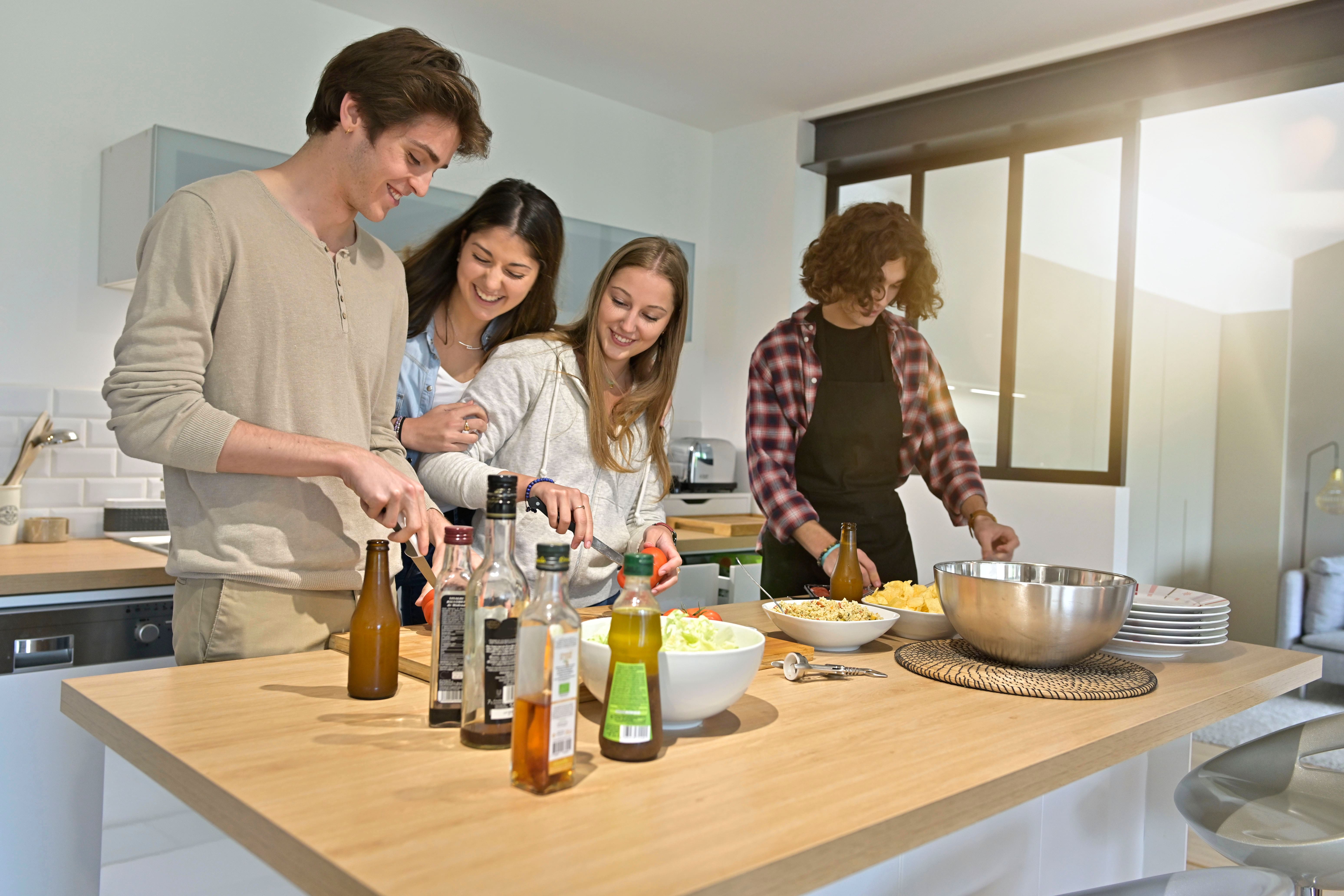 Co-living tenants in a shared kitchen