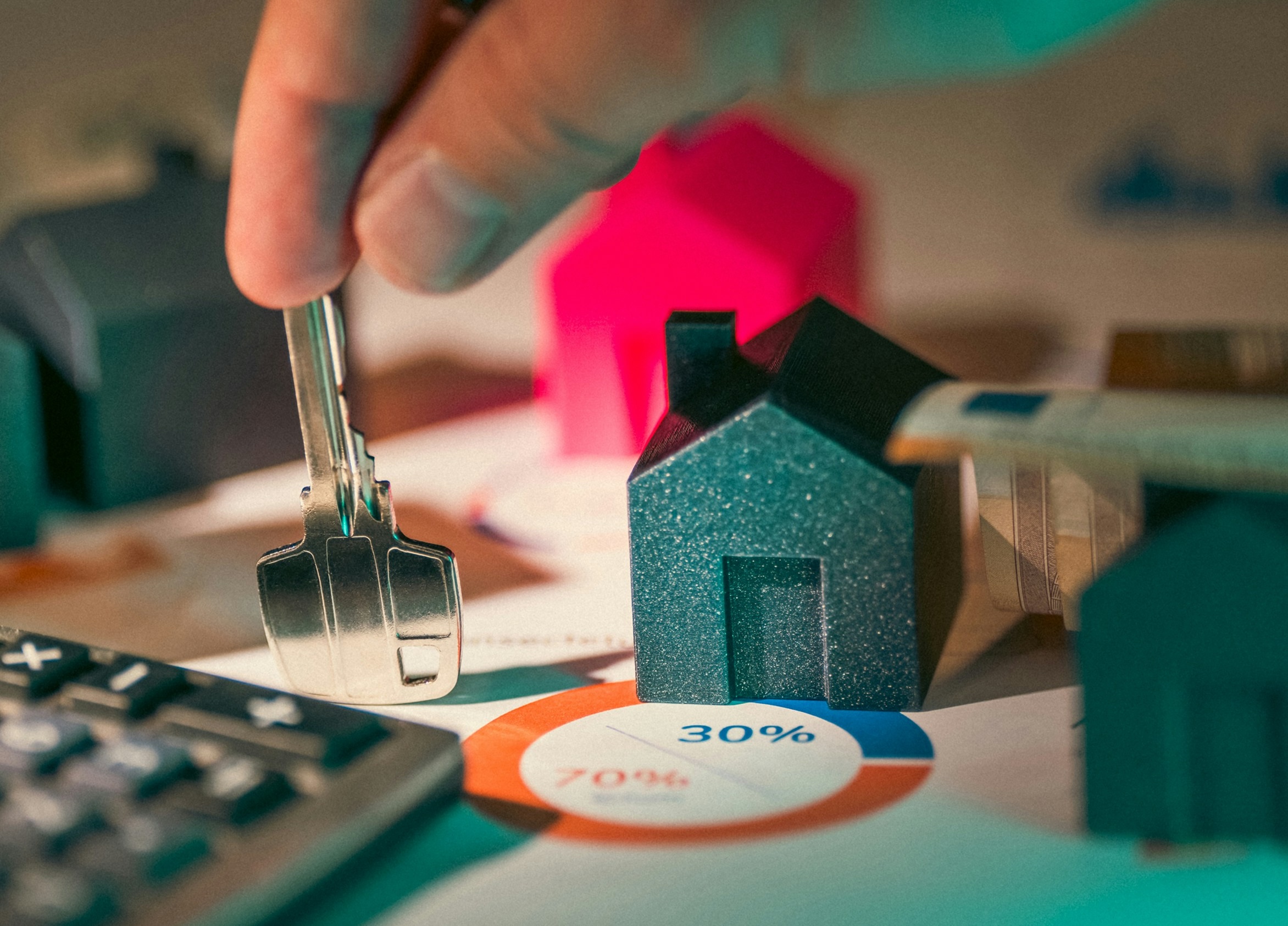 Calculating property investment, man holding a key